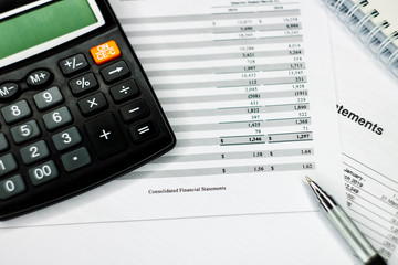 Finance savings concept, business equipment on paperwork.
