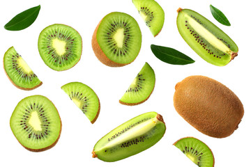 kiwi fruit with slices and green leaves isolated on a white background. top view