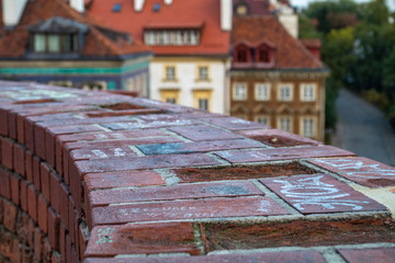 Old brick wall with messages written on it