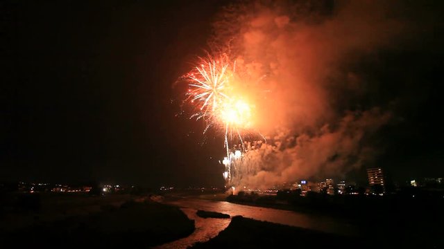Fireworks above Ueda city and Chikuma river, Japan