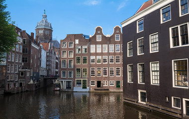 Fototapeta na wymiar Amsterdam buildings on the water, Netherlands.