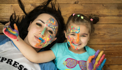 Mother and daughter. Happy family. Bright makeup.