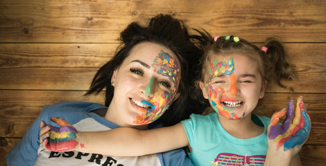 Mother and daughter. Happy family. Bright makeup.