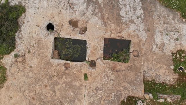 Wine press. The ruins of the late Hellenic Jewish settlement Hurvat Sumak on Mount Carmel, Israel. View from the drone.