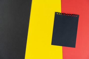 Blacklist Belgium. Mourning, ban, sanctions, politics. black sheet of notebook lies on Belgian...