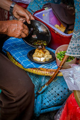 Fototapeta premium Traditional street food fried tofu mixed crushed chilli, garlic, shallot and sauce