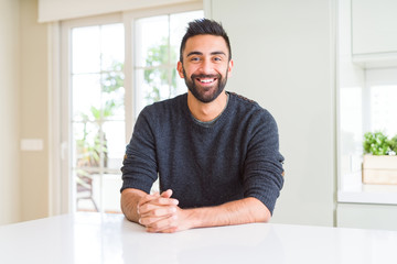 Handsome man smiling cheerful with a big smile on face showing teeth, positive and happy expression