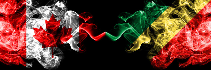 Fototapeta premium Canada vs Congo, Congolese smoky mystic flags placed side by side. Thick colored silky smoke flags of Canadian and Congo, Congolese.