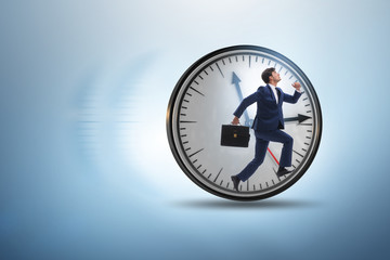 Businessman employee in time management concept