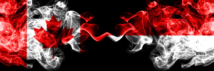 Canada vs Indonesia, Indonesian smoky mystic flags placed side by side. Thick colored silky smoke...