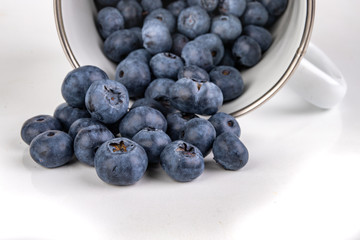 Tasty ripe blueberry fruit on the kitchen table. Ingredients for a delicious dessert in the home kitchen.