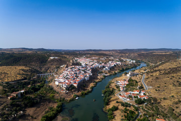 Aerial view of the beautiful village of Mértola in Alentejo, Portugal; Concept for travel in Portugal and Portuguese historical villages.