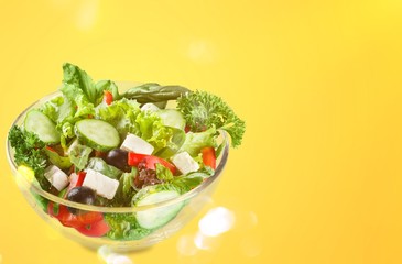 Closeup of Greek salad with feta cheese, cherry tomatoes and lettuce
