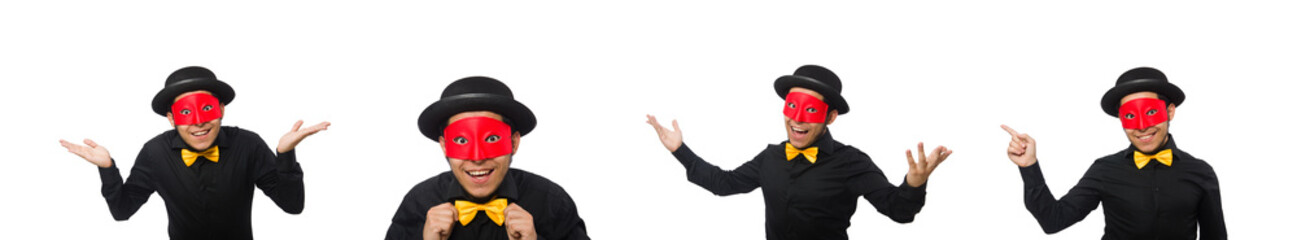 Young man in black costume and red mask isolated on white