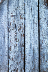 wall of old painted cracked wooden boards. Vintage background for photos