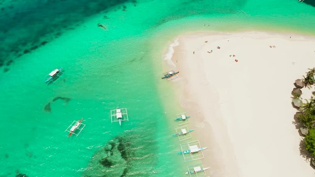 Tropical landscape: Daco island with beautiful beach, palm trees by turquoise water view from above. Siargao, Philippines. Summer and travel vacation concept