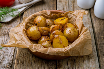 baked mini potatoes on wooden table