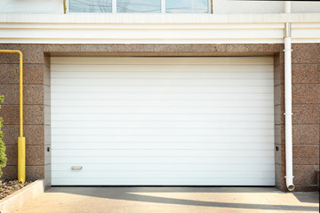 Obraz na płótnie Canvas Closed roller shutter door of modern garage