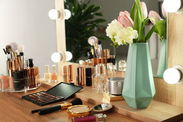 Dressing table with set of luxury cosmetic products. Interior element