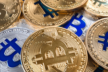 Shiny bitcoins as background, closeup view. Digital currency