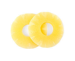 Slices of delicious sweet canned pineapple on white background, top view