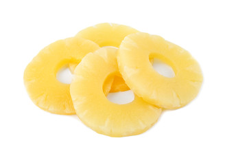 Slices of delicious sweet canned pineapple on white background