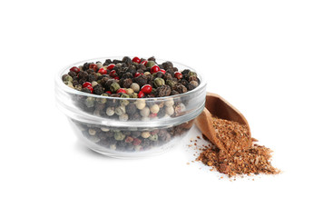 Ground pepper and corns isolated on white