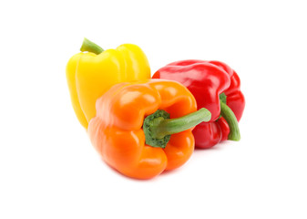 Fresh ripe bell peppers on white background