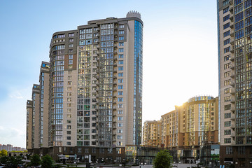 Modern buildings with tinted windows against sky. Urban architecture