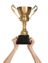 Young woman holding gold trophy cup on white background, closeup