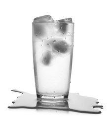 Glass of cold clear water with ice on white background. Refreshing drink