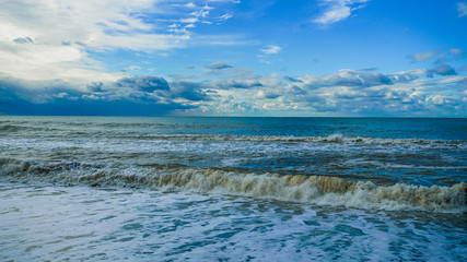 blue sea and cloudy sky waves