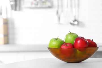 Bowl of fresh apples on kitchen counter. Space for text