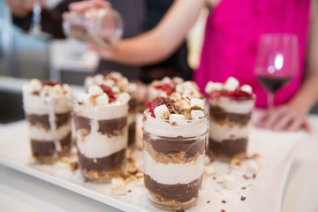 marshmallow and pudding dessert being prepped in kitchen