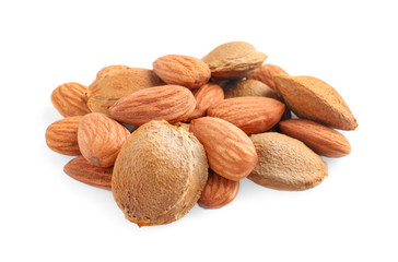 Organic dried apricot kernels on white background