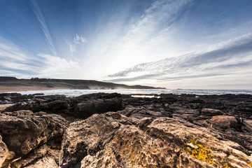 Obraz premium Landscape of a beach with sunset light in northern Spain