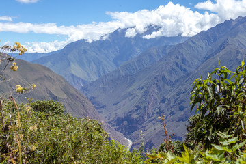Landscape with green deep valley, Apurimac River canyon, Peruvian Andes mountains on Choquequirao...