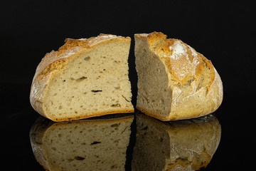 Group of two slices of fresh baked rye wheat bread isolated on black glass