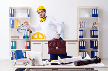 Young male architect working in the office