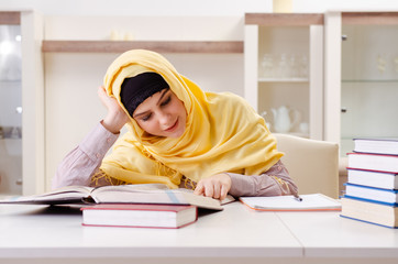 Female student in hijab preparing for exams