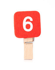 clip wooden peg with numbers 6 isolated on a white background