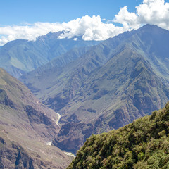 Landscape with green deep valley, Apurimac River canyon, Peruvian Andes mountains on Choquequirao trek in Peru