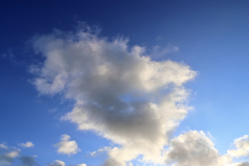 Beautiful white fluffy clouds on a deep blue sky