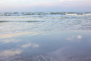 Smooth sand at the beach and beautiful wave texture background.