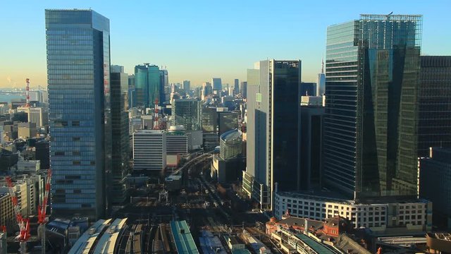 Trains in city at sunrise