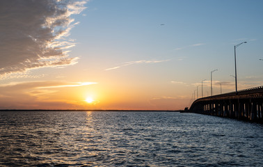 Fototapeta na wymiar Sunrise of the Tampa Bay in Florida near a bridge.