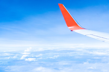 Fototapeta premium Air plane flying over the cloudy sky background. Concept of transportation, traveler and tourism.