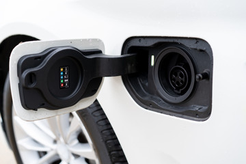 Charging socking in plug-in hybrid electric vehicle close up.