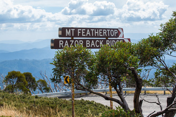 Sign for Mt Feathertop and Razor Back Ridge with clouds gathering in the background in the alpine high country region of Victoria Australia