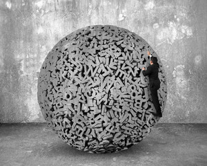 Big data concept. Business man climbing on gray concrete ball of huge amount 3d letters and numbers.